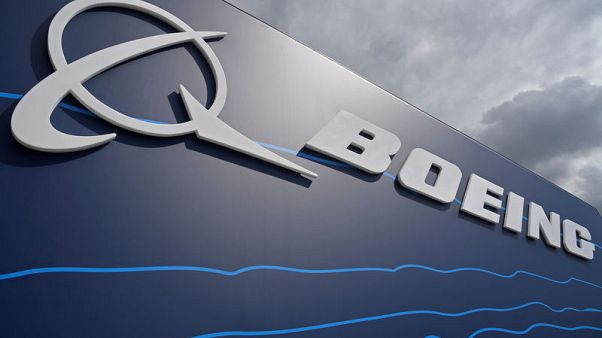 Boeing tops profit estimates, takes further tanker charge Boeing tops profit estimates, takes further tanker charge