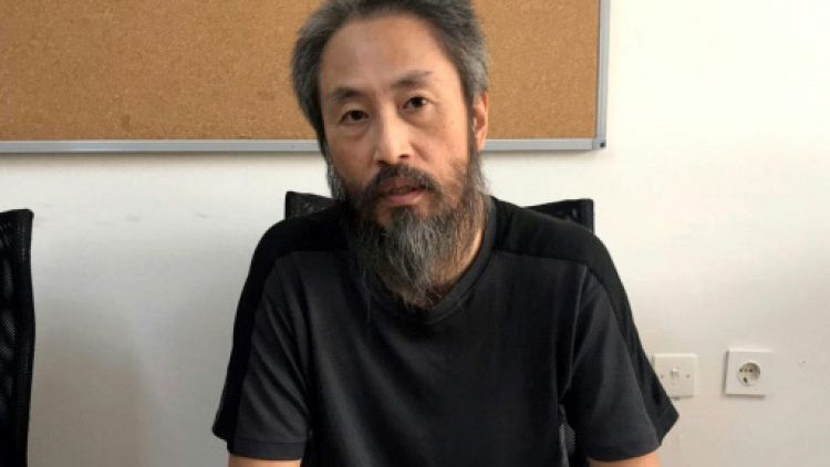 Le journaliste ex-otage en Syrie de retour au Japon après un "enfer"