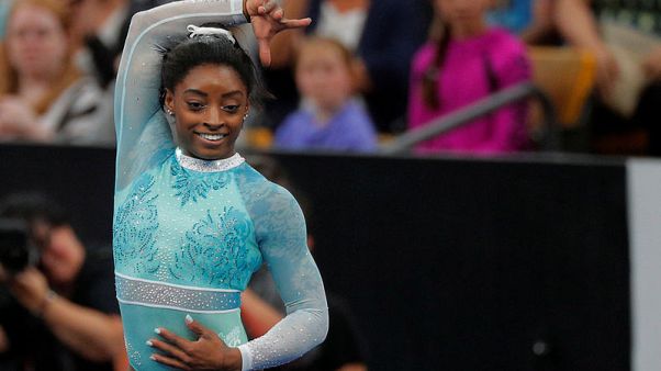 Gymnastics - Biles leads world championships qualifying despite kidney stone Gymnastics - Biles leads world championships qualifying despite kidney stone