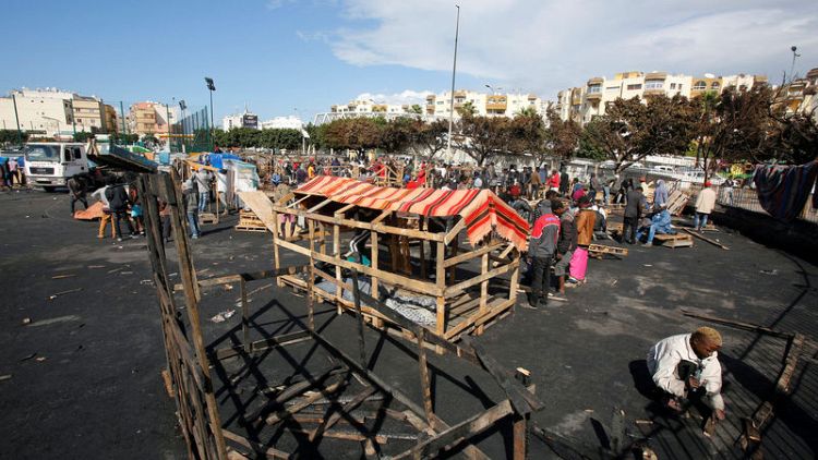 African migrants rebuild Casablanca camp destroyed by fire