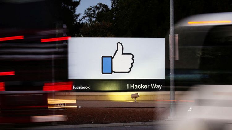 Facebook shares stung by slow user, sales growth