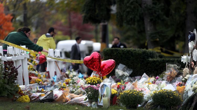 Pittsburgh buries three more shooting victims as suspect faces new charges
