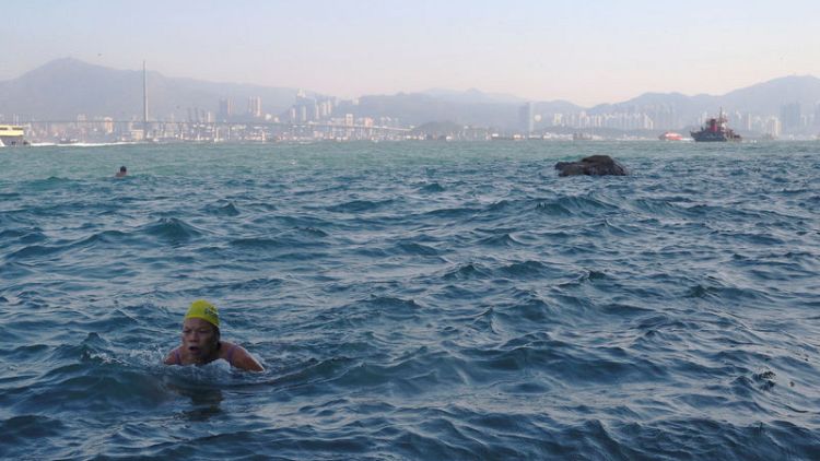 Taking the plunge: Hardy Hong Kong swimmers brave busy harbour