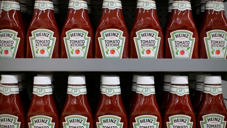 Kraft Heinz quarterly income falls by a third, shares slide