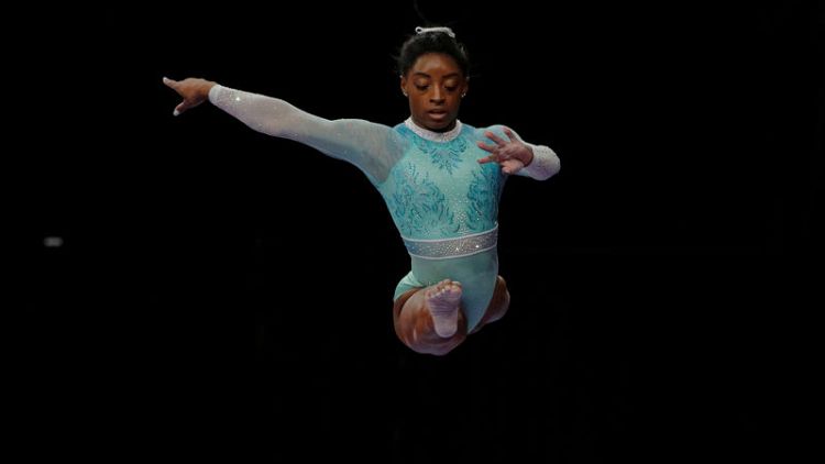 Gymnastics - Biles makes history with fourth all-around world title