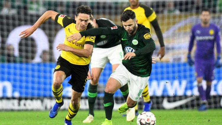 Dortmund go four points clear with win at Wolfsburg