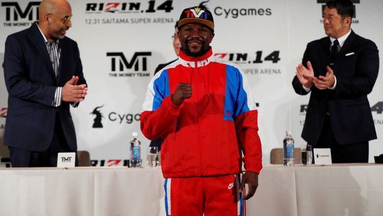 Mayweather takes his money team to mystery fight in Japan