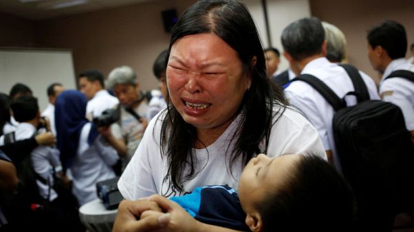 Tearful relatives of Indonesia jet crash victims demand answers Tearful relatives of Indonesia jet crash victims demand answers