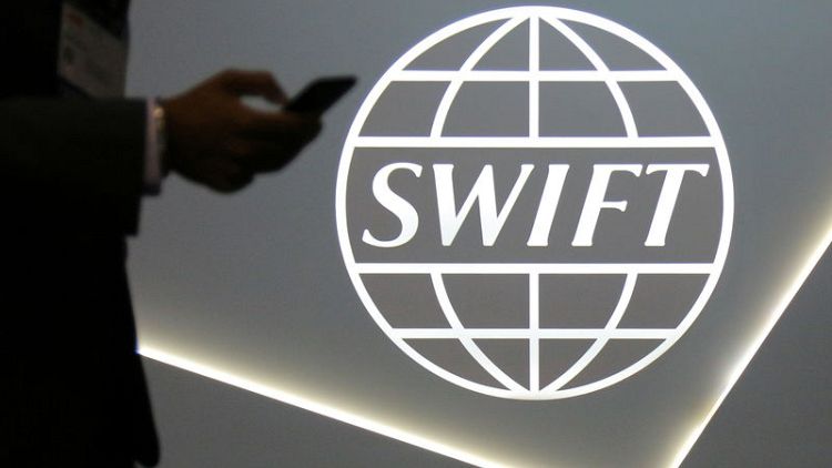 EU says SWIFT decision on Iran banks regrettable
