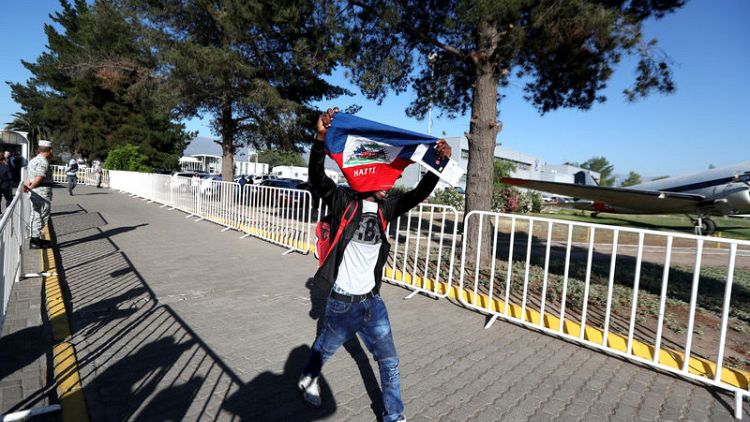 Chile sends 176 Haitian migrants home on criticised 'humanitarian flight'