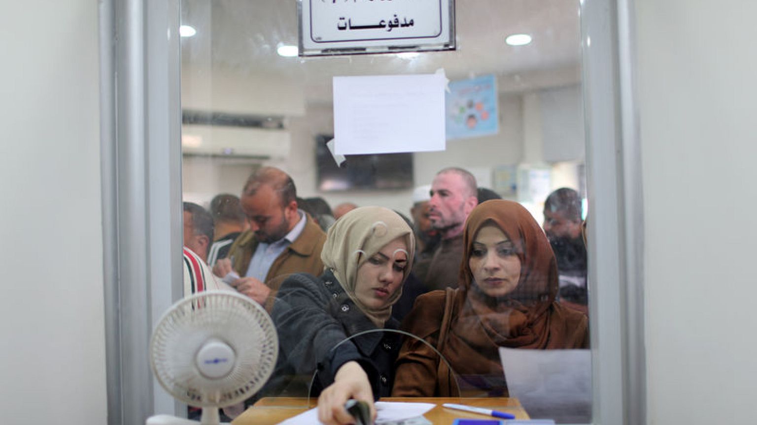 Qatar pays Gaza salaries to ease tensions; Israel says money's not for Hamas