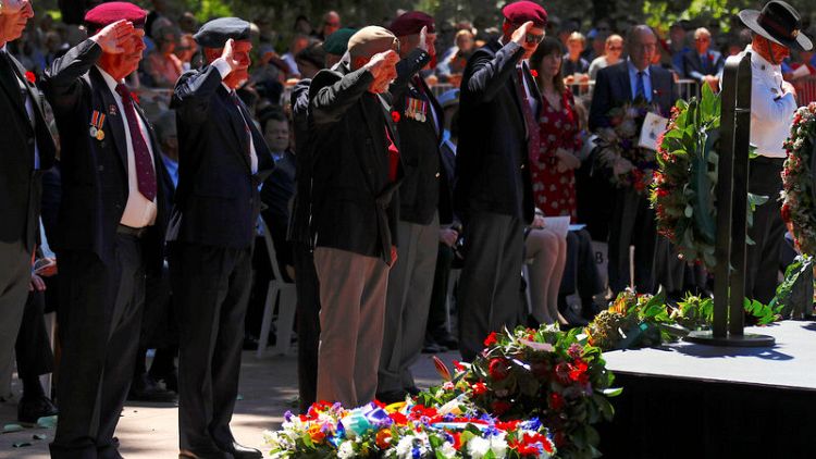 Thousands mark WW1 Armistice in Australia, unbowed by attack