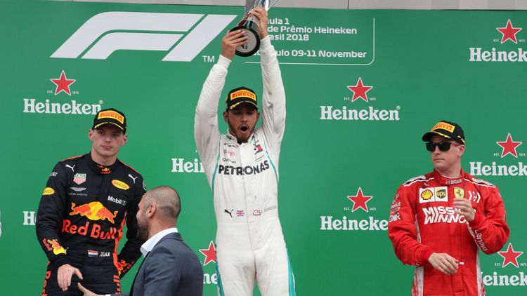 Hamilton wins in Brazil as Mercedes take fifth F1 title