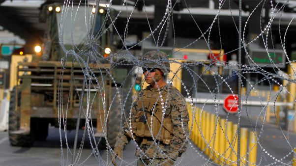 U.S. lays barbed wire at border as migrant caravan draws closer U.S. lays barbed wire at border as migrant caravan draws closer