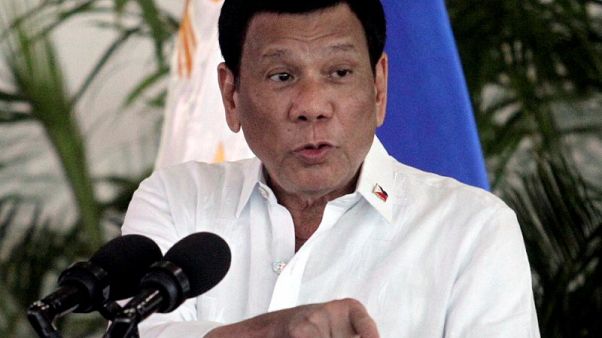 Philippines' Duterte skips summit meetings but is in "top shape" Philippines' Duterte skips summit meetings but is in "top shape"