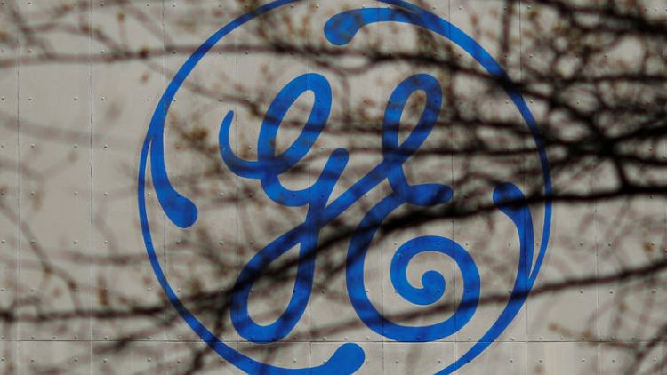 Baker Hughes, GE fall after offering priced at discount