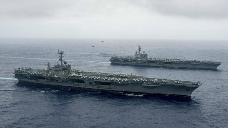 U.S. carriers join up in East Asia for 'complex' warfare drills