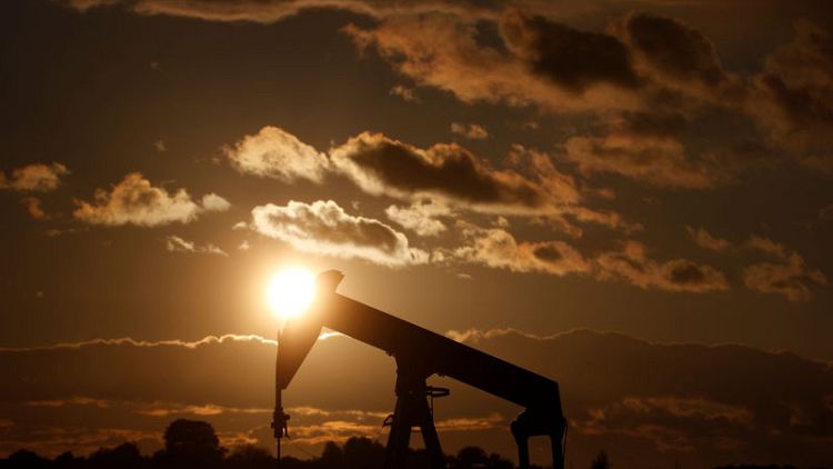 Oil prices stable on expected OPEC cuts, but surging U.S. supply drags