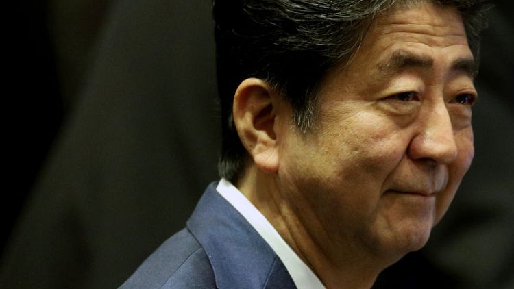 Japan PM tells Putin no U.S. bases on disputed isles if handed over - Asahi
