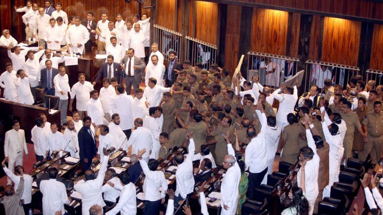 Bottles, chilli paste thrown as Sri Lanka parliament descends into farce