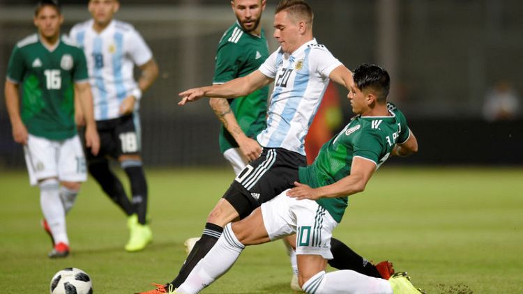 Goal in each half gives Argentina 2-0 win over Mexico