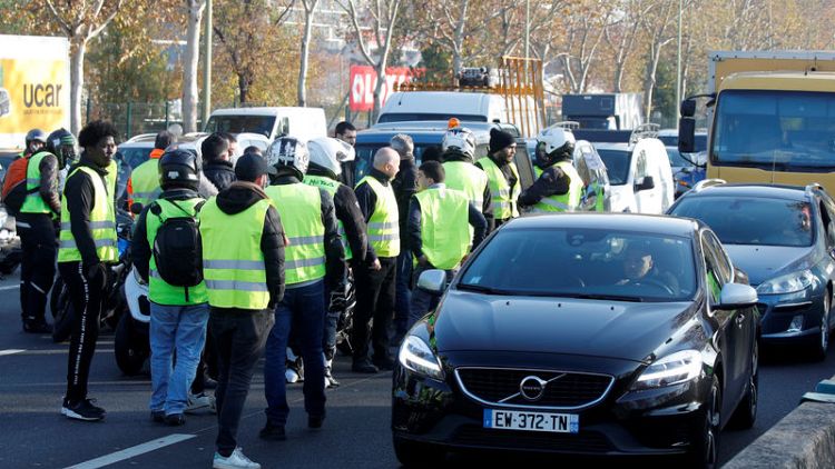 French protesters rail against Macron's fuel taxes with road blocks