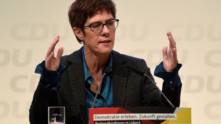 Merkel protege eyes female quota for lawmakers, takes aim at dual citizenship