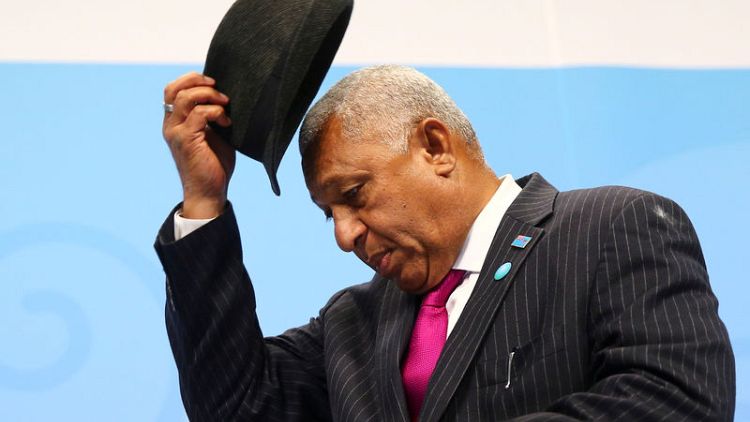Fiji prime minister narrowly wins election to serve a second term
