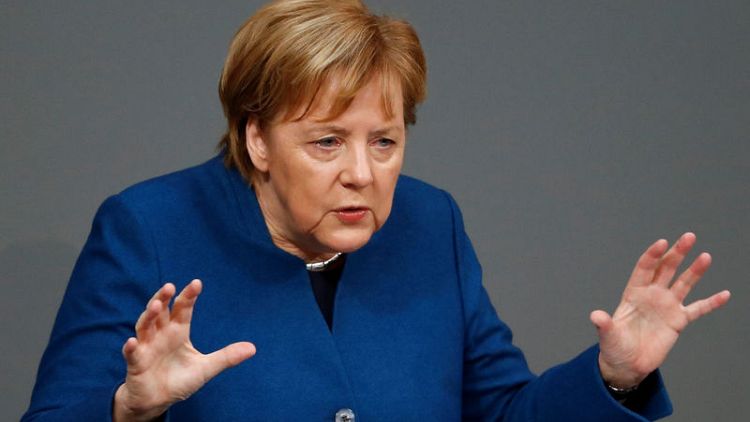 Merkel brands opponents of U.N. migrant pact 'nationalists'