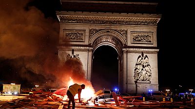 French police clash violently with protesters on Champs Elysees over petrol costs French police clash violently with protesters on Champs Elysees over petrol costs