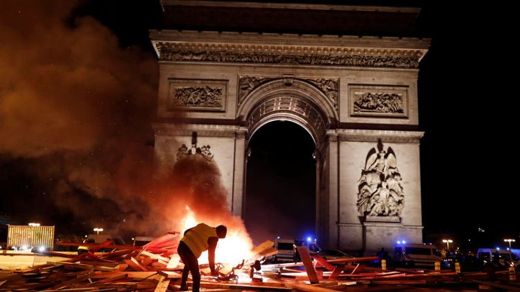French police clash violently with protesters on Champs Elysees over petrol costs