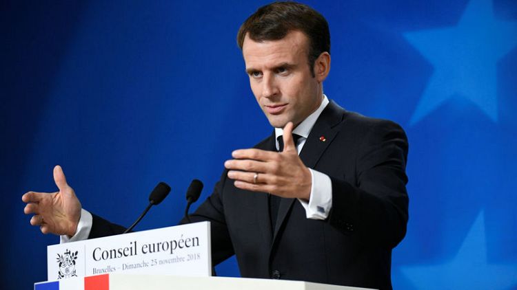 France's Macron praises courage of slain Syrian radio activist Fares