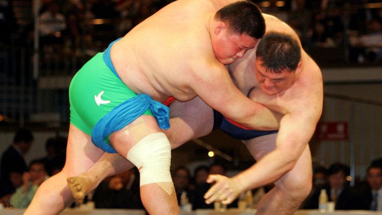 North, South Korea join hands to get wrestling on U.N. culture list