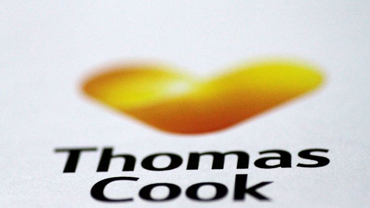 Thomas Cook cuts profit forecast, suspends dividend on weak British market