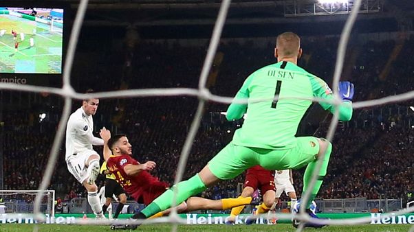 Real Madrid seal top spot with 2-0 win at Roma Real Madrid seal top spot with 2-0 win at Roma