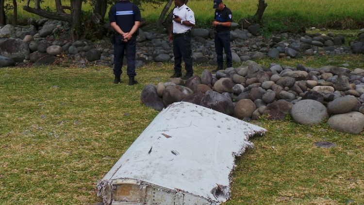 Relatives of missing from Malaysia plane say they have found pieces of debris
