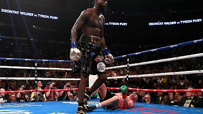 Boxing - Wilder draws with Fury to retain WBC heavyweight title