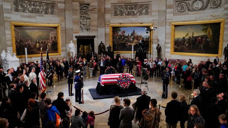 Washington pays respects to Bush as he lies in state at Capitol