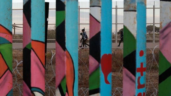 Tired of waiting for asylum, migrants from caravan breach U.S. border Tired of waiting for asylum, migrants from caravan breach U.S. border