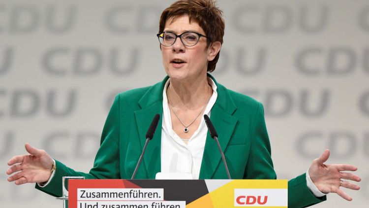 Germany's new CDU chief to review liberal Merkel migration policies