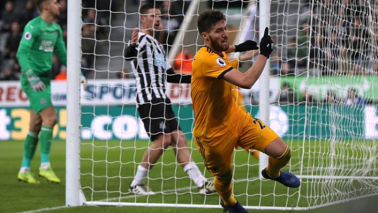 Soccer-Newcastle beaten in added time by Wolves after sending off