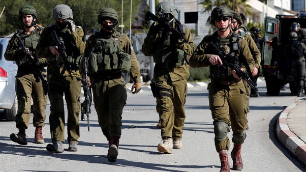 Israeli troops raid Palestinian news agency for footage Israeli troops raid Palestinian news agency for footage
