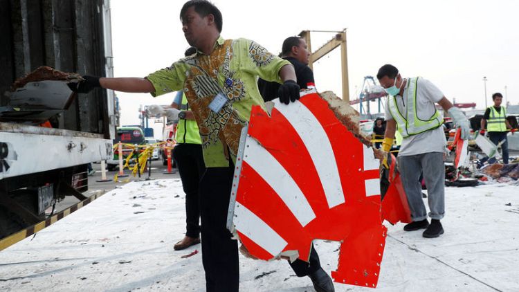 Lion Air crash victims' families rally as hunt for wreckage steps up
