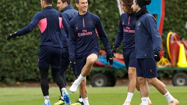 Arsenal's Koscielny finds his smile on return from injury