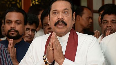 Sri Lanka's newly appointed PM Rajapaksa resigns - party lawmaker, son