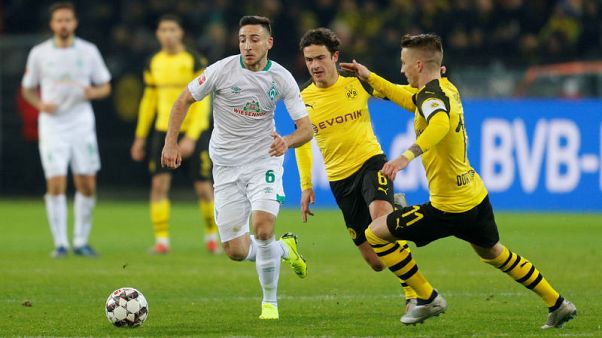 Dortmund beat Bremen 2-1 to guarantee 'autumn title' Dortmund beat Bremen 2-1 to guarantee 'autumn title'