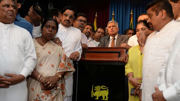 Sri Lanka lawmakers defect from president to prime minister after dispute Sri Lanka lawmakers defect from president to prime minister after dispute