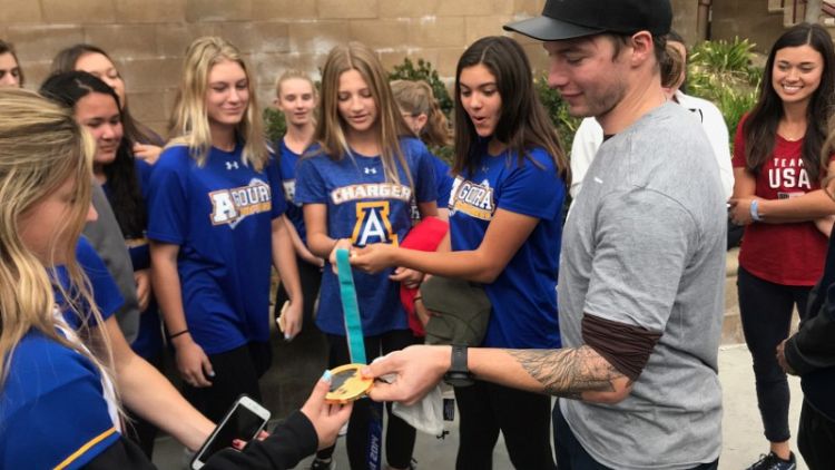 Olympians make surprise visit to California schools hit by wildfire