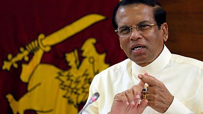 Sri Lanka president names 30-member cabinet, reappoints finance minister