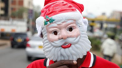 Santa hats, beards and tinsel: Christmas trade on African streets